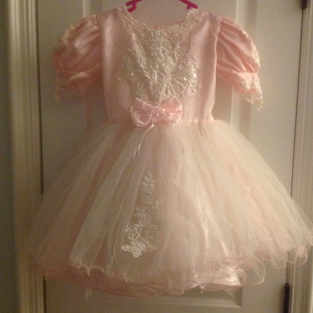 Soft pink dress with overlay lace with beading.